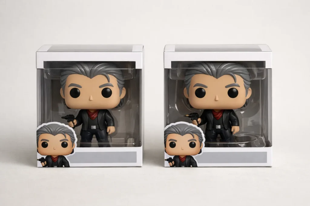 Deux Funko Pop du même personnage présentées côte à côte dans des boîtes dont les visuels diffèrent légèrement.